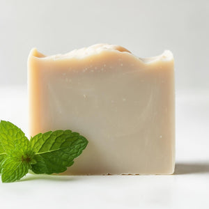 BumZap Ultra Zing soap against a white background with a sprig of mint next to it